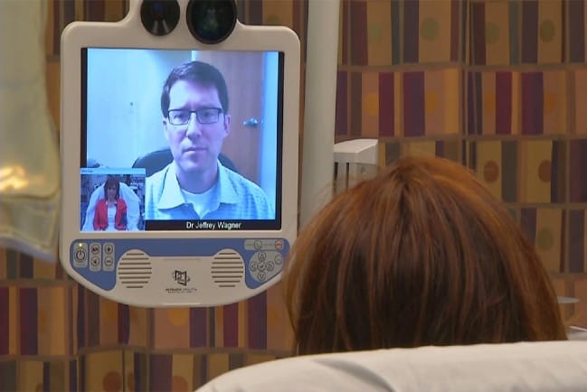 Care provider speaking to patient through computer screen