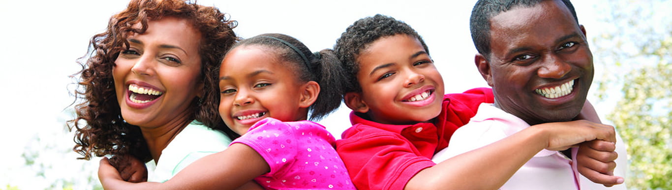 Smiling family of four.