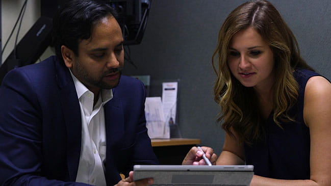 Man and woman looking at computer screen